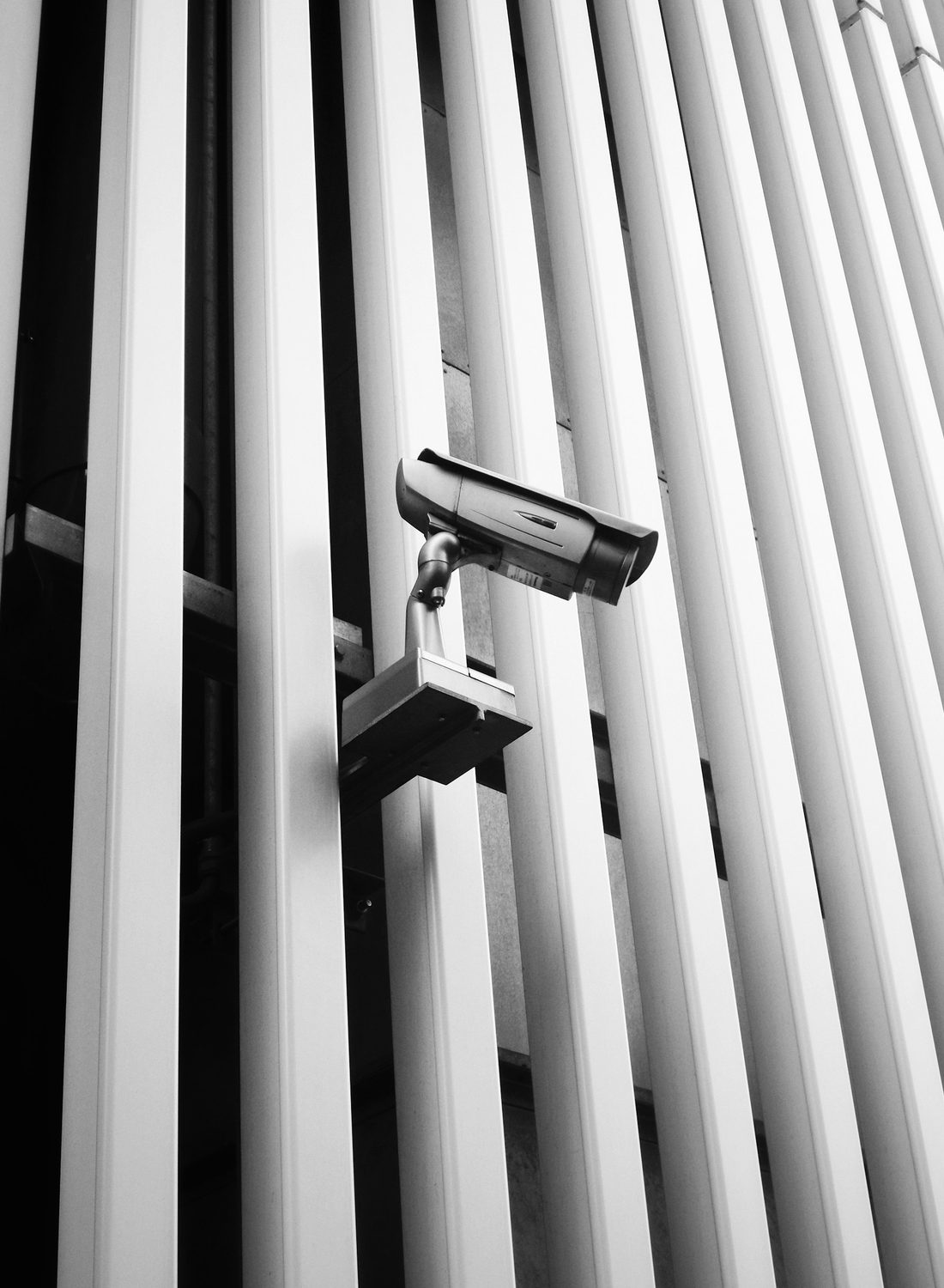 Security camera mounted on a modern building facade